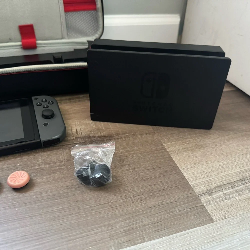 Nintendo Switch with Black and Gray Accessories